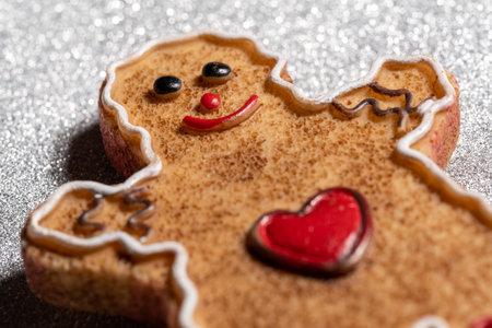 Gingerbread man with heart and bows on his legs, close upの写真素材