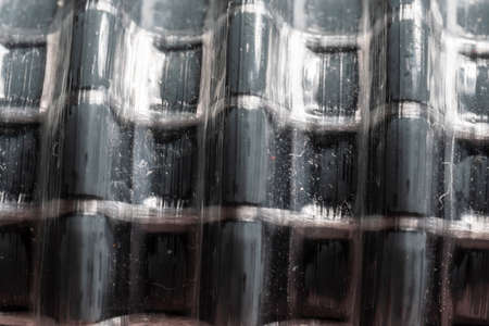 Abstract, gray flexible corrugated pipe in the form of a spring, close-upの写真素材