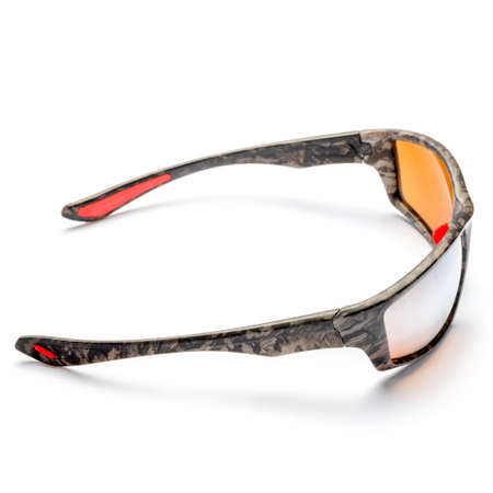 Orange and camouflage sun goggles close-up on a white.の写真素材