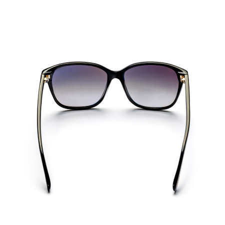 Black, women's sunglasses on a white background.の写真素材