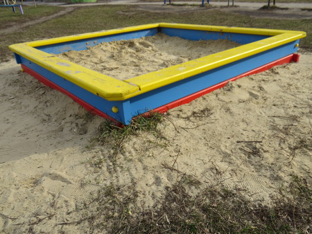 Small square sandpit in the playground outside.の写真素材
