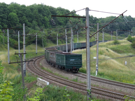 Freight train passing on a bend of the trackのeditorial素材
