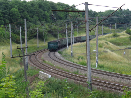 Freight train passing on a bend of the trackのeditorial素材