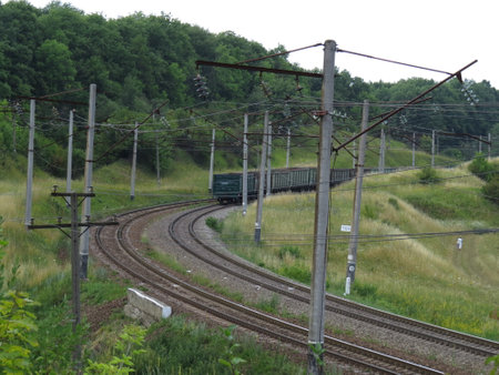 Freight train passing on a bend of the trackのeditorial素材