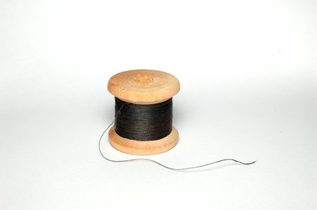 A small coil of black thread.