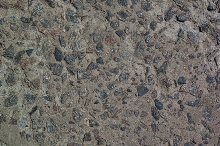 background - part of a concrete wall with granite stonesの写真素材