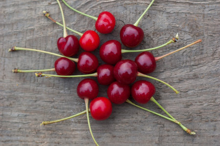 Cherries on a wooden background in natural light.