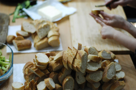The process of preparing a festive dinner: dishes, serving, sandwiches, salads.