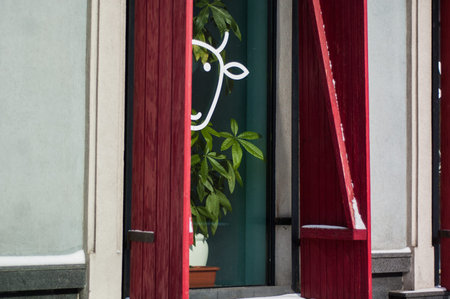 Bright red shutters and windows - a view from the outside.