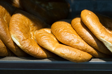 A lot of small bread in the store.