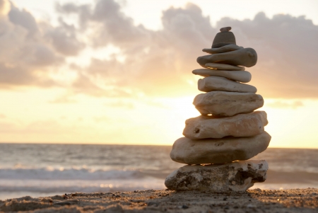 Balance - A composition of stacked stones on the beach の写真素材