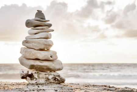Balance - A composition of stacked stones on the beach の写真素材