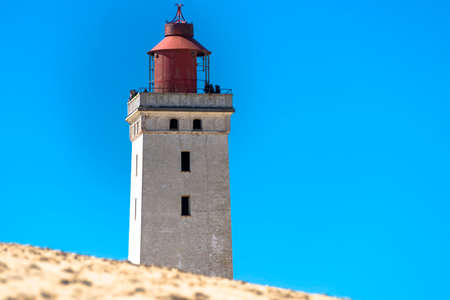 The lighthouse Rubjerg Knude on the north sea coast in Denmarkの写真素材