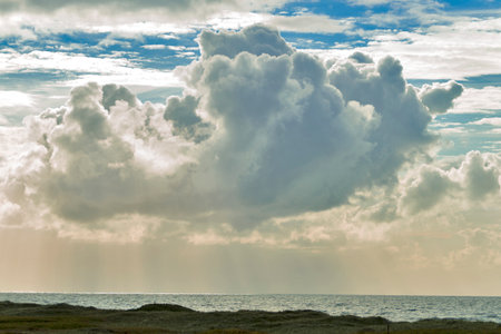 Dramatic cloudscape over the north sea coast in Denmark. Dramatic sky with storm clouds.の写真素材