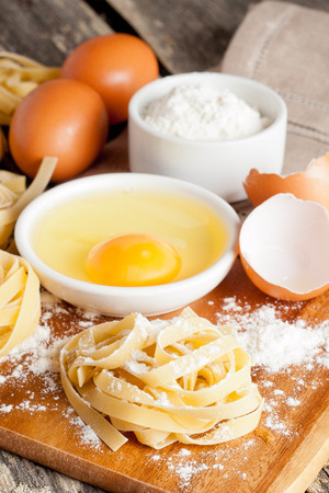 raw homemade pasta and ingredients for pasta, close up, verticalの写真素材