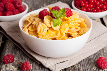 Cornflakes and different Berries, horizontal, close up