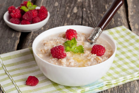 oatmeal with raspberries and honey, horizontal, close upの写真素材