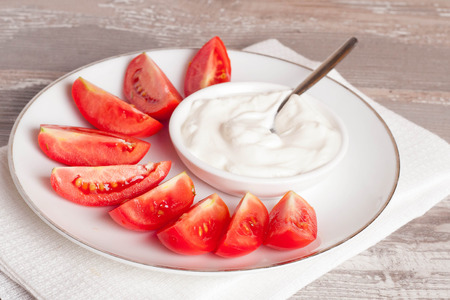 tomatoes and sour cream. close up, horizontalの写真素材