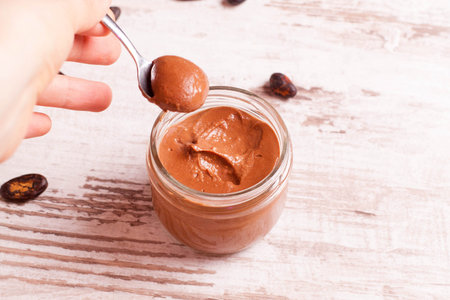 chocolate paste in a glass jar closeup top view horizontal