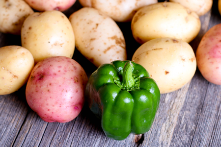 Fresh vegetables potato and Green Pepper, close up, horizontalの写真素材