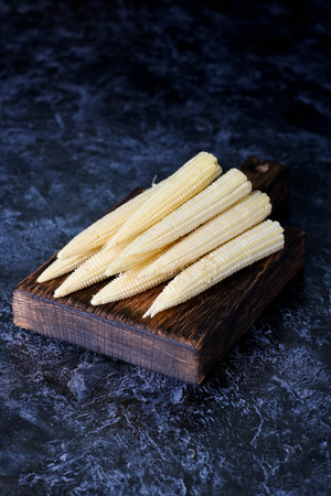 Baby corn cobs, close up, verticalの写真素材