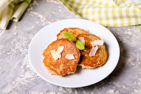 Cottage cheese pancakes with banana, decorated mint, close up, horizontal, top viewの写真素材
