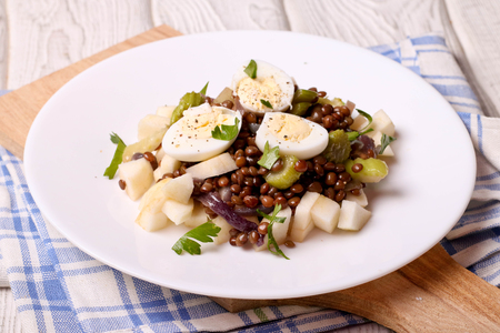 Lentils salad with apple and egg, close up, horizontalの写真素材