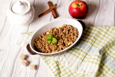Oatmeal apple cowberry crumble cobbler in ceramic bowl, close up, top view, horizontalの写真素材