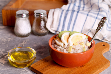 Barley porridge with egg and onion, close up, horizontalの写真素材