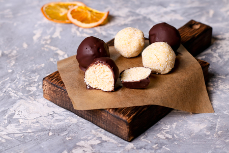 Homemade healthy vegan chocolate candys with honey and coconut flakes, close up, horizontalの写真素材