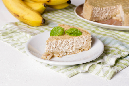 Banana cream pie on a white plate, close up, horizontalの写真素材