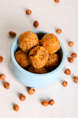 Healthy homemade energy balls with apricot and nuts, verticalの写真素材