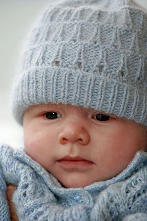 Baby in woollen clothesの写真素材