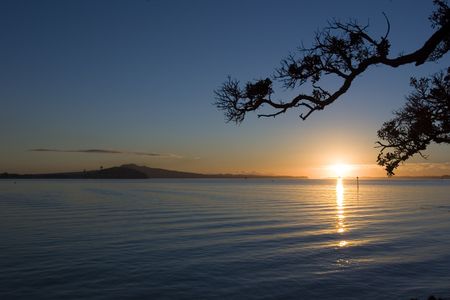 Auckland Sunrise showing Rangitoto Island and North Head scene from Tamaki Drive at sunriseの写真素材