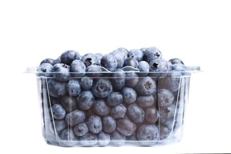 Fresh natural blueberries in plastic packaging isolated on white.の写真素材