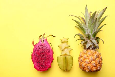 Ripe exotic fruits on a yellow background.の写真素材