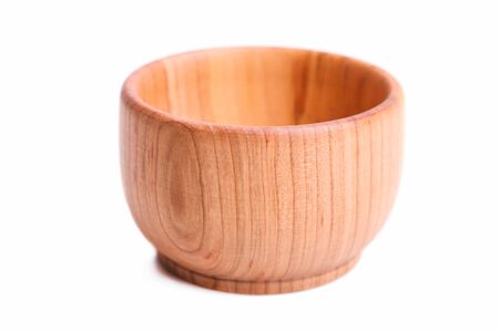 Wooden empty mortar isolated on a white background.の写真素材