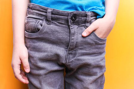 Boy in gray jeans close-up. Stylish look.の写真素材