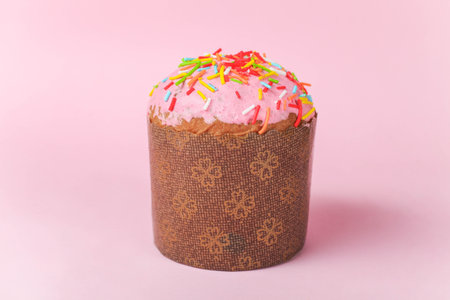 Easter cake with sprinkles on a pink background.