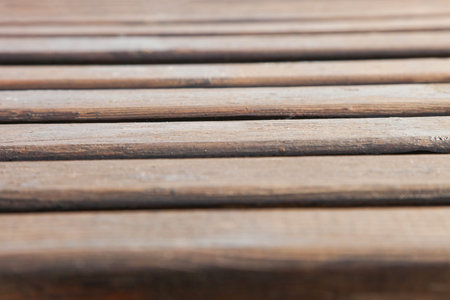 Background from brown wooden planks of a bench. Texture.