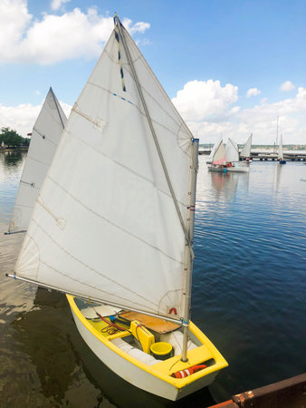 A group of children on sailing boats on the river. Yachtingの写真素材