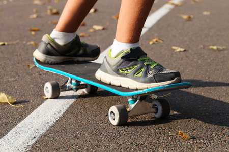 Boy on a skateboard in the park. Extreme sport.