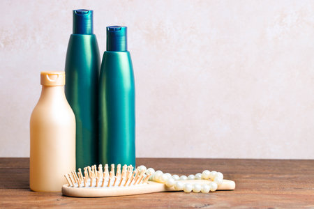 Hair care products and accessories on a brown background.