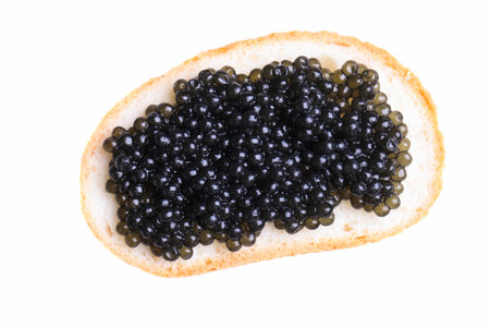 Sandwich with black sturgeon caviar isolated on white background.の写真素材