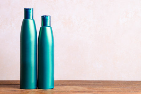 Bottles of shampoo and hair conditioner on white background.