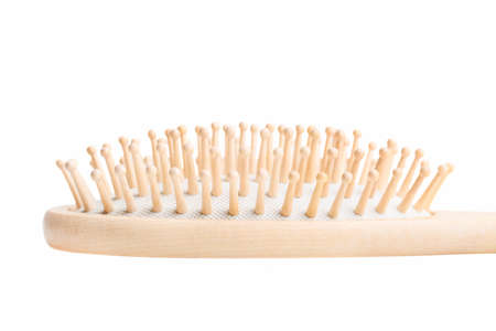 Wooden massage hair brush isolated on white background.の写真素材
