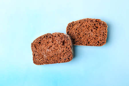 slice of rye bread on blue background.の写真素材