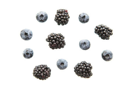 Blueberries and blackberries isolated on white background.の写真素材