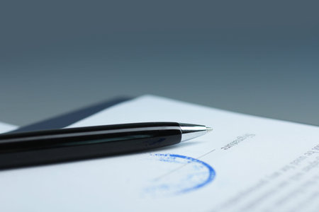 Pen on a sheet of paper. Signing a contract close-up. signature.