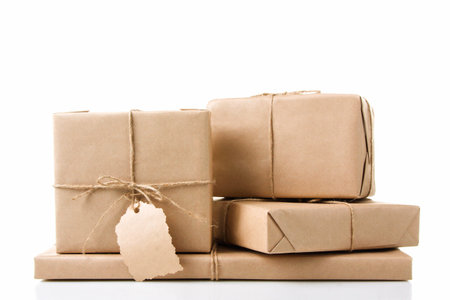 four small package tied with rope on white isolated background